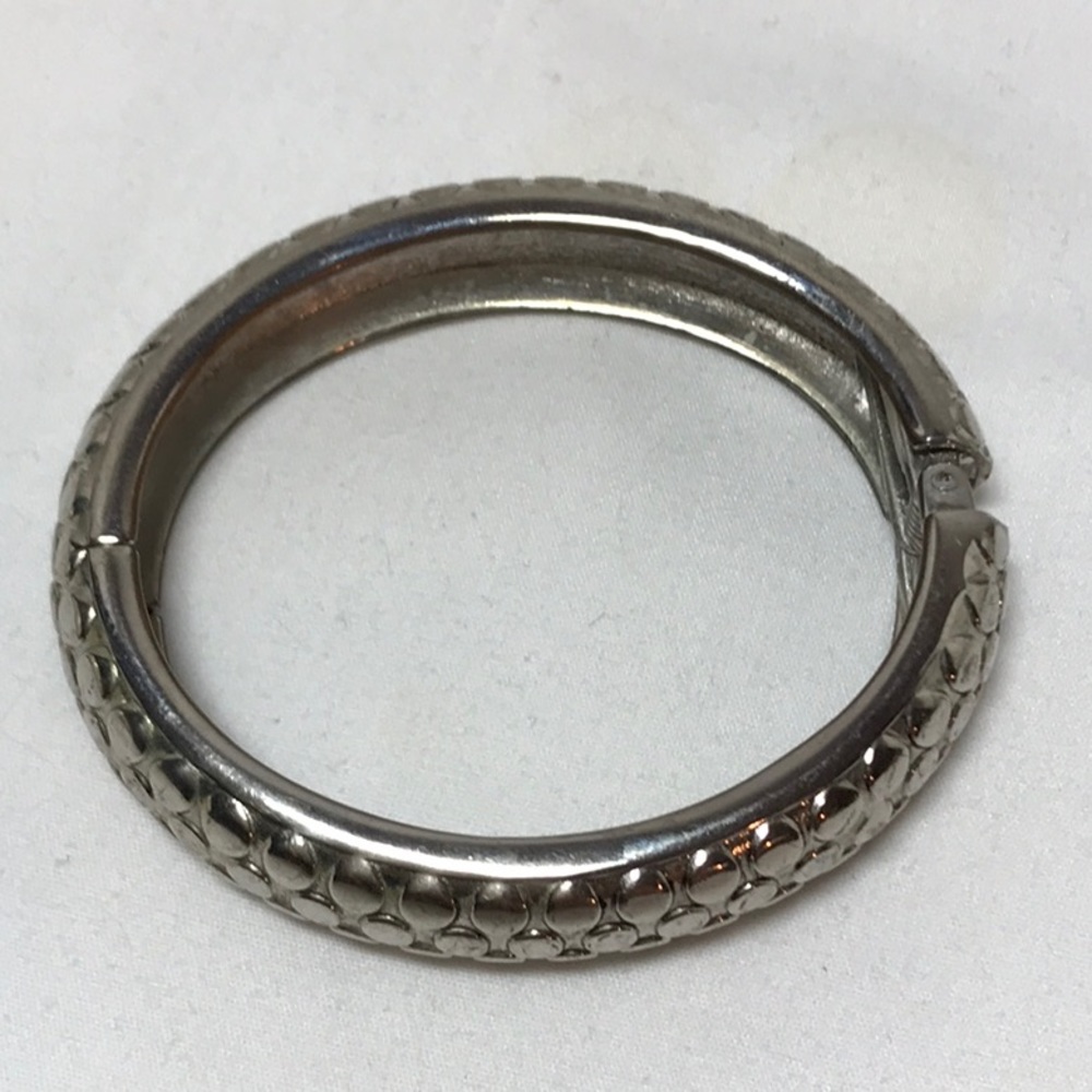 Hinge bracelet in silver tone, textured circles on outside, fits 7 in wr…